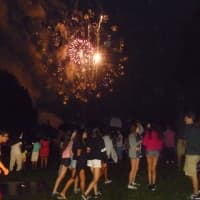 <p>Dozens watched the fireworks display behind White Plains High School Wednesday despite the rain. </p>