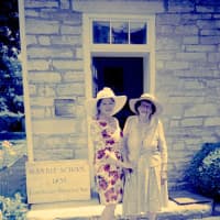 <p>Standing before the 1835 Marble Schoolhouse are Eastchester Historical Society President Annemarie Flannery and Anne Hutchinson-Bronxville Chapter DAR member Virginia Kathryn Hefti. </p>