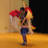 <p>Lily performs a dance from her tribe for a crowd of New Rochelle onlookers.</p>