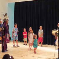 <p>Raven demonstrates an Iroquois Smoke Dance for New Rochelle children.</p>