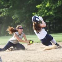 <p>A Norwalk Riptide player avoids the tag and slides safely into base.</p>