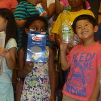 <p>White Plains students show the types of items they have been recycling this summer. </p>