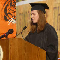 <p>Valedictorian Mimi Zimmer addresses her class at the Mamaroneck High School commencement.</p>
