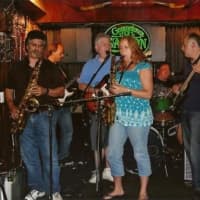 <p>Cover band Third Stone kicked off the concert series on Wednesday, July 9.</p>