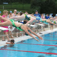<p>Swimmers from Yorktown Pool and Willowbrook Swim &amp; Tennis Club dive in.</p>