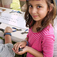 <p>Bridgeport resident 7-year-old Flora Cunha came with her mother to help with banding of the baby purple martins at Westport&#x27;s Sherwood Island State Park. </p>
