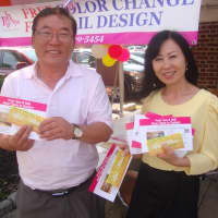 <p>Jason and Esther Su promote the newly opened Posh Spa and Nail at the Darien Sidewalk Sales and Family Fun Days.</p>