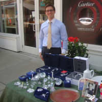 <p>David Harvey Jewelers manager John Breznen greets customers outside the store during the Sidewalk Sales.</p>