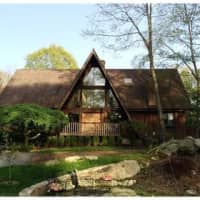 <p>This house at 35 Old Mill River Road in Pound Ridge is open for viewing on Sunday.</p>
