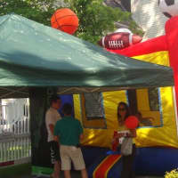 <p>Kids jump on an inflatable house at the Darien Sidewalk Sales and Family Fun Days.</p>
