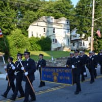 <p>Mount Kisco firefighters march in the parade.</p>