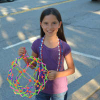 <p>Mount Kisco resident Lilliana Davey, 8 and a half, poses for a photo before the start of the parade.</p>