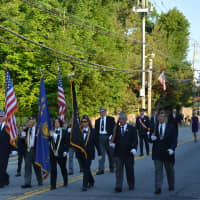 <p>A color guard marches in the parade.</p>
