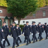 <p>Pleasantville firefighters march in the Mount Kisco parade.</p>