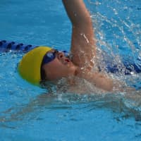 <p>A Chappaqua swimmer pushing his backstroke.</p>
