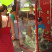 <p>Bankwell set up a booth for kids to try and catch as much fake cash as they could for prizes.</p>