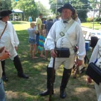 <p>Visitors and re-enactors discuss military life in the Revolutionary War at the Norwalk Historical Society.</p>