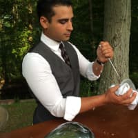 <p>Part of Fairfield resident Justin Pasha&#x27;s new business, The Cup Bearer, is offering freshly chipped ice that he makes himself for the cocktails he serves.</p>