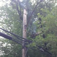<p>The power pole is still smoldering after a Tuesday morning fire on Ely Avenue in Norwalk. </p>