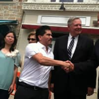 <p>Oscar Moreno, manager of the former Tino&#x27;s nightclub and restaurant, shakes hands with Stamford&#x27;s Public Safety Director Ted Jankowski, while Mayor David Martin looks on. From left are Chief Jonathan Fontneau and Alice Lei, Tino&#x27;s co-owner.</p>