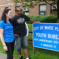 <p>Sheila Foley (left) and Frank Williams (right) welcome back Marcus Walton as he visits the White Plains Youth Bureau. </p>