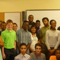 <p>The White Plains Youth Bureau students pose with Marcus Walton (back center). </p>