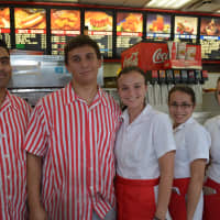 <p>Staffers from Red Rooster pose for a photo.</p>