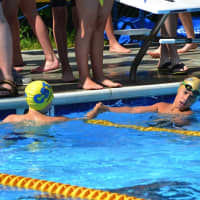 <p>Chappaqua and Katonah swimmers greet each other after a race.</p>