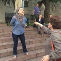 <p>Several residents attending a pro-Israel rally in White Plains Thursday exchanged heated words with a woman protesting Israel. </p>