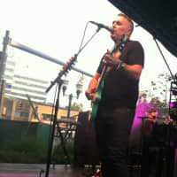 <p>Ed Robertson of Barnaked Ladies sings while stuffed animals lay on the stage behind him at Alive@Five.</p>