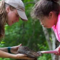 <p>Westmoreland Sanctuary Education Director Rachel Diersen shows a Boys &amp; Girls Club of Northern Westchester SMART Girl how to scan for aquatic life.</p>