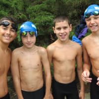 <p>A group of Willowbrook swim team boys after a race at a meet against Katonah on July 19.</p>