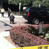 <p>Police investigate the scene of a fatal SUV-pedestrian accident Monday afternoon in Stamford. A 49-year-old Stamford woman is dead after she was struck by a Chevrolet Tahoe. The driver suffered non-life threatening injuries.</p>