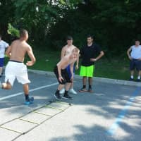 <p>Agility and sprint training in the Carmel High School parking lot, July 23.</p>