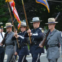 <p>State troopers and sheriff&#x27;s department members march in the Brewster parade.</p>