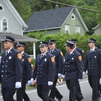 <p>Brewster firefighters march in the parade.</p>