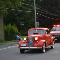 <p>A line of Brewster fire vehicles in the parade.</p>