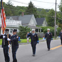 <p>Putnam Lake firefighters march in the Brewster parade.</p>