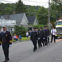 <p>Kent firefighters march in the Brewster parade.</p>