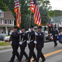 <p>Mahopac Falls firefighters march in the Brewster parade.</p>