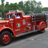 <p>A vintage Croton Falls firetruck in the Brewster parade.</p>