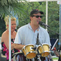 <p>Ken Nichols singing a song from the 1990s as part of the Bronxville Summer Concert Series.</p>