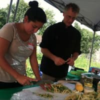 <p>Alejandra Garces and Gavin Pritchard prepare beans for the salad they are making at the Farm to Table workshop. </p>
