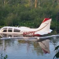 <p>The 1984 single-engine Beechcraft Bonanza is floating after landing in a pond just south of the Danbury Airport on Thursday evening. The pilot was not injured but had to be rescued by rowboat in the 10-foot waters. </p>