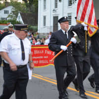 <p>Bedford Hills firefighters march in the Bedford Fire Department&#x27;s parade.</p>