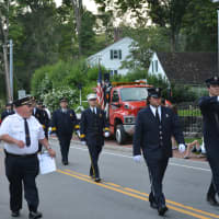 <p>Firefighters march in the Bedford Fire Department&#x27;s parade.</p>
