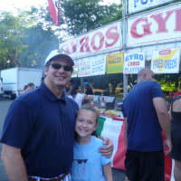 <p>Pat Morano (left) and his daughter Giastina, 11, wait to get funnel cake. </p>