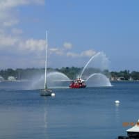 <p>The 38-foot Robert Bedell Fire Boat from Norwalk sprays water off the Saugatuck Shores boat launch in Westport after a drill. </p>