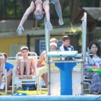 <p>Kate Posner, 11,  dives for Chappaqua Swim &amp; Tennis in the 13-Under girls diving competition.
</p>