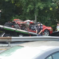 <p>The vehicle involved in the fatal crash being placed on a tow truck Wednesday morning.</p>